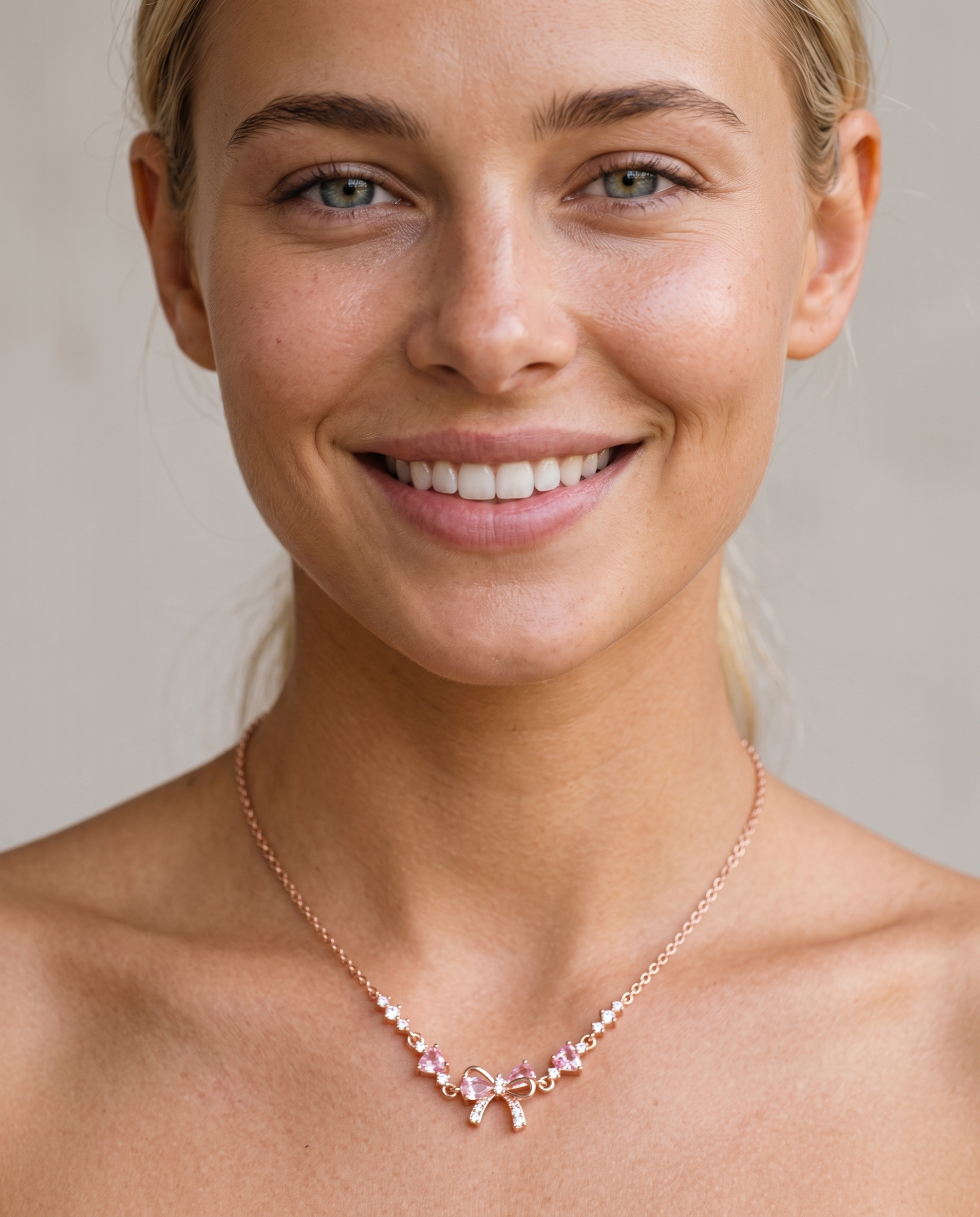 Lexi wearing the zircon bow necklace