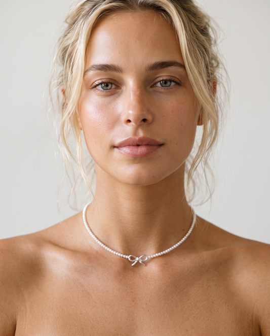 Lexi wearing the beaded bow pearl necklace
